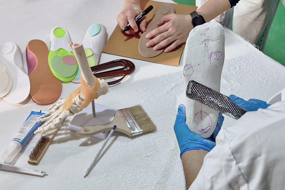 Custom insole crafting process showing molds and design. Professional one-stop OEM/ODM solution for orthotic R&D and mass production
